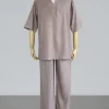 Loose gray short-sleeve tunic with a V-neck and matching wide-leg pants on a mannequin (loungewear set).